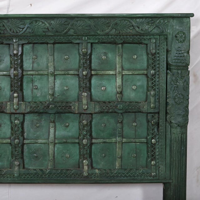 Once part of a historic Indian home, this teakwood door has been reimagined as a striking queen-size headboard. Its carved...