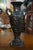 A pair of bronze vases on marble bases which feature cherubs at play. A lovely accent to a fire place mantle. In very good...