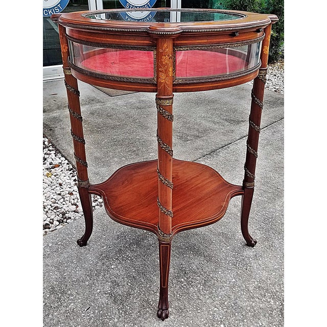 A great accent of a side table, this modern day interpretation of a classic French bijouterie table with heavy beveled...