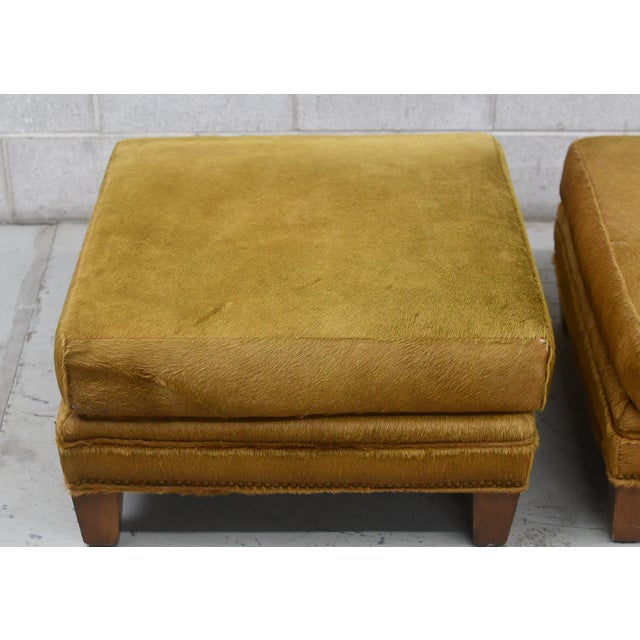 Oh-so-fun are these jolly pair of horsehide ottomans by Royal Custom Designs, Inc. Square in footprint and ideal to sit on...