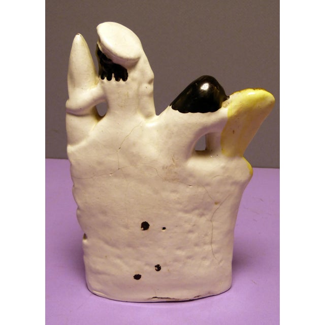 Offered is this antique Staffordshire figurine of a couple in between 2 objects (wheat, barley?). They stand a bold 8"...