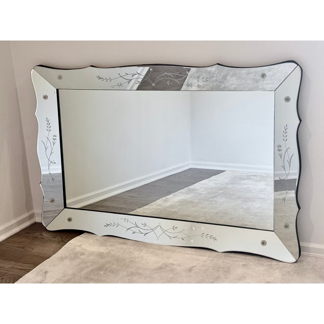 Exceptional and unusually large Venetian wall mirror dating to the 1950s, measuring an impressive 66" wide by 42" high....