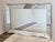 Exceptional and unusually large Venetian wall mirror dating to the 1950s, measuring an impressive 66" wide by 42" high....