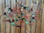 Colorful abstract metal wall sculpture by Artisan House, featuring an energetic arrangement of spirals, circles, squares,...