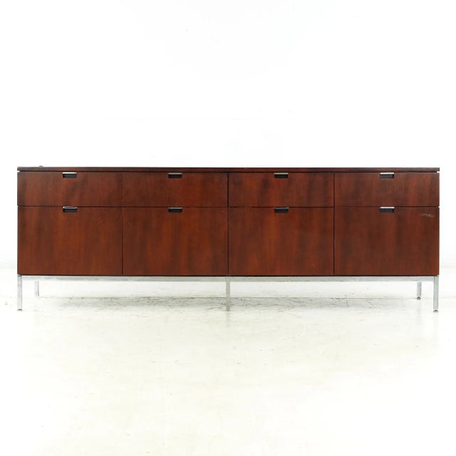 Florence Knoll Mid Century Walnut and Chrome Credenza This credenza measures: 74.5 wide x 18 deep x 25.75 inches high When...