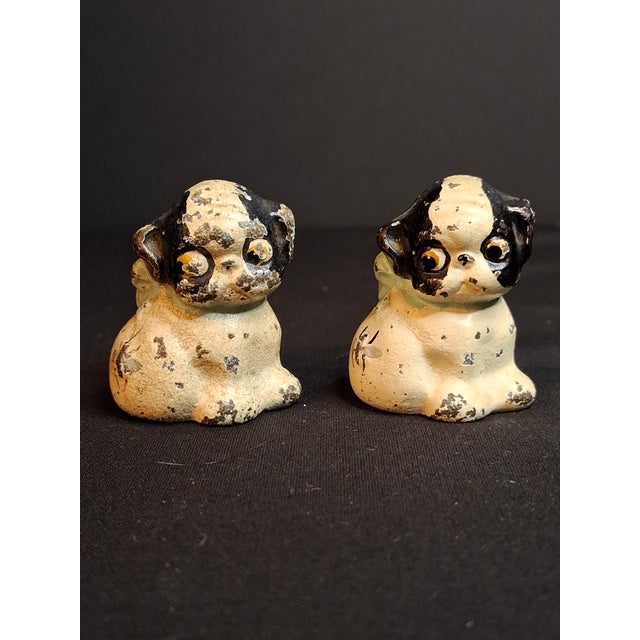 This is a rare matching pair of authentic 1920s vintage/antique cast iron miniature paperweights or favor toys...