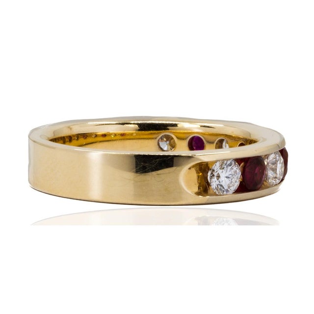 Elevate any outfit with our 18k Ruby & Diamond Band. This stunning band features a vibrant ruby center, adding a touch of...