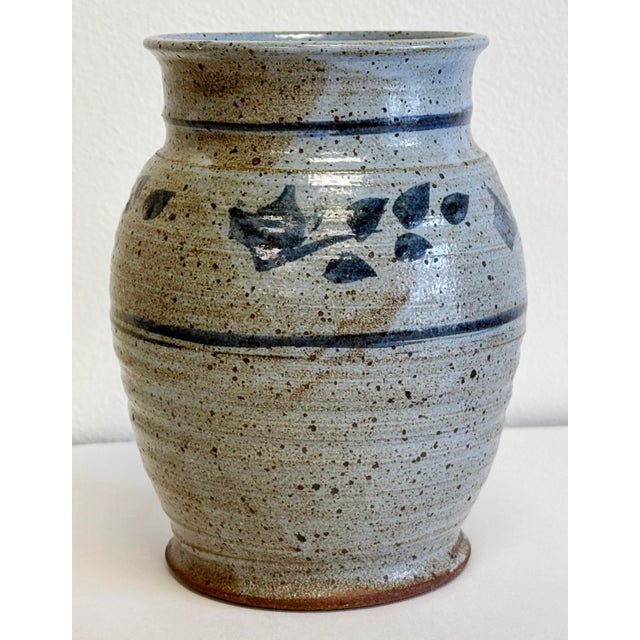 Vintage studio pottery vase vessel with blue gray tone speckled glaze and banded floral design to top half. Fluted mouth...