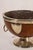 19th-century pedestal bowl featuring an oak body, silver-plated rim, and lion head handles.