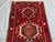 This exquisite vintage runner rug, hand-knotted in the 1960s, showcases a stunning Yelemeh design that reflects...