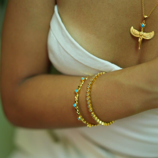 Experience the sparkle and energy of the Diamond & Gold Dainty Bangle Bracelet, designed to elevate both your style and...