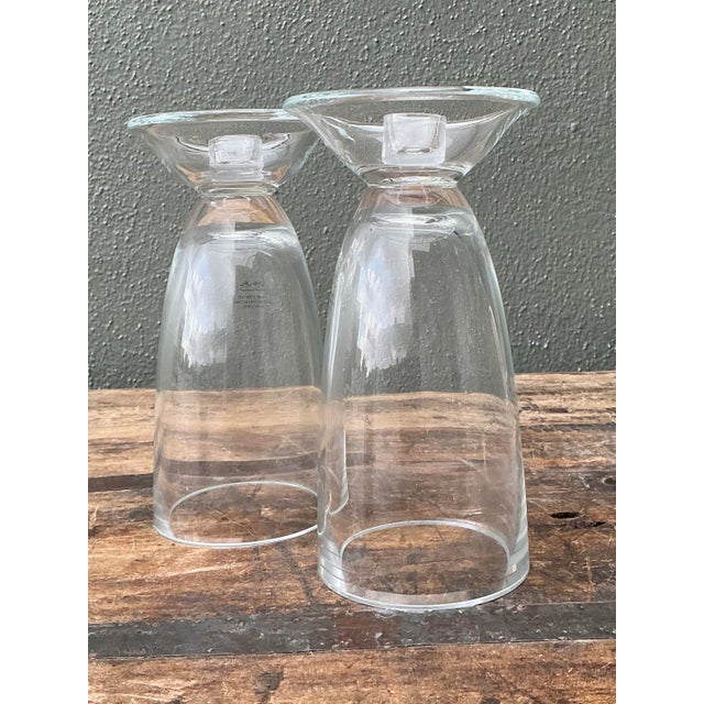 This elegant pair of glass candlesticks is a masterclass in Postmodern design, bearing the unmistakable architectural...