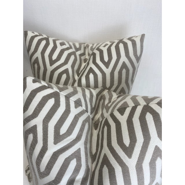 Custom pair of 22" pillows covered in a medium scale geometric jacquard fabric. These pillows have tapered corners to...