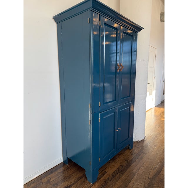 Vintage solid wood armoire (likely 1950s-60s) professionally refinished with a high-gloss teal lacquer exterior and...