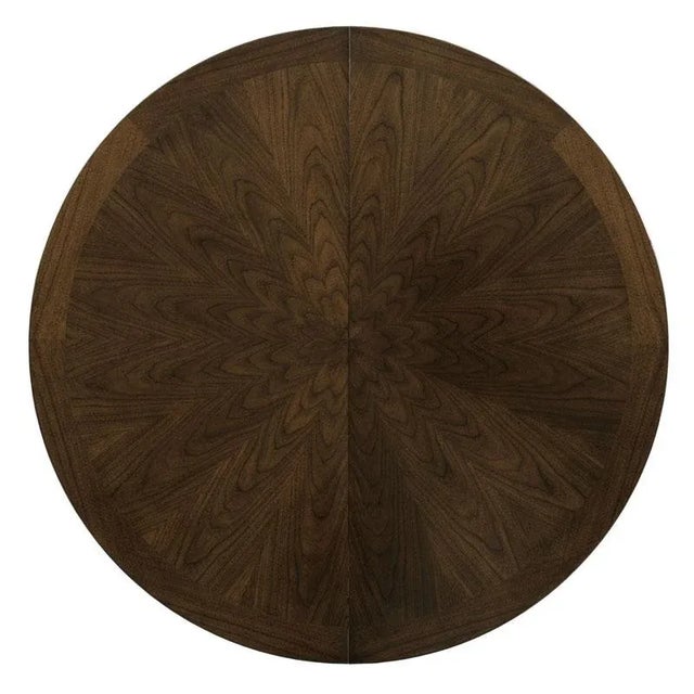 A wonderful table for dining with a round top that divides at its center to accommodate 2-18” fillers. The table is...