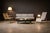 This pair of armchairs is defined by its economy of line and material restraint. A slender metal frame establishes the...
