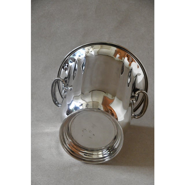 A heavy silverplate wine chiller by Gorham, with a stepped rim, concentric ring detailing and two side handles in a clean...