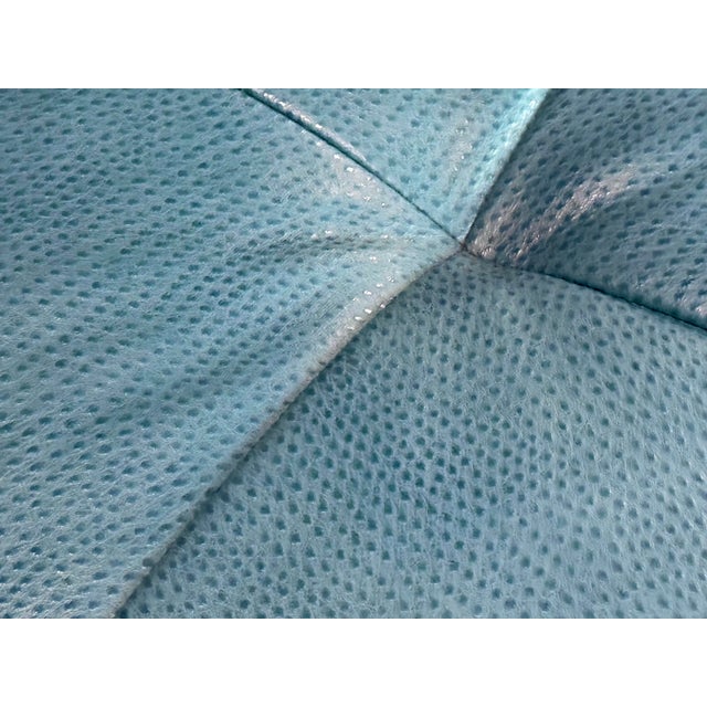 Elegant, large square 48" by 48" blue pebbled tufted leather ottoman with luxurious nailhead and featuring caster wheels...