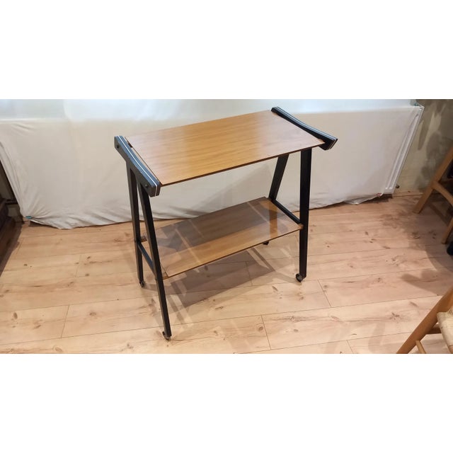 Vintage Mid-Century Modern TV stand made in former Yugoslavia, circa 1960s–1970s. Features a distinctive black wooden...