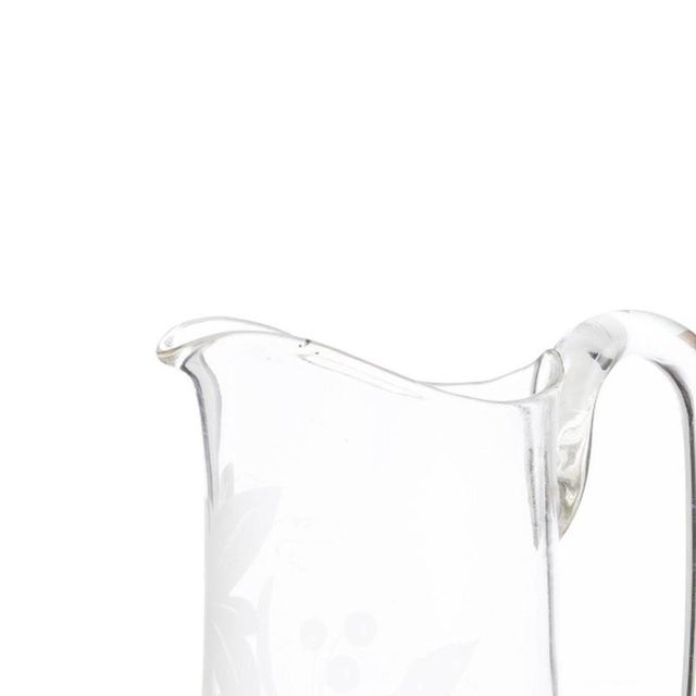Glass and Crystal - Two mugs. Made of molded glass with fire-decorated designs depicting vegetal motifs; manufactured in...