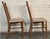 These chairs feature original striped upholstered seating and solid walnut construction. The attractive spindle backs make...