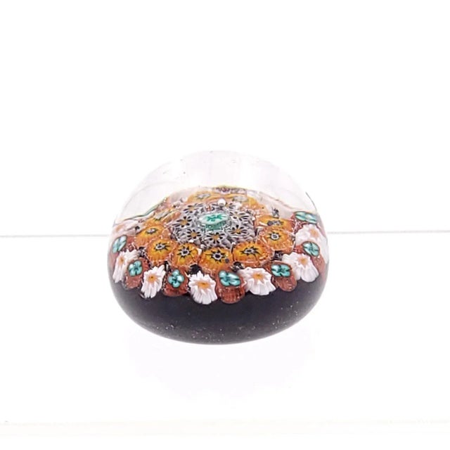 A vintage paperweight in white and orange millefiori pattern, England.