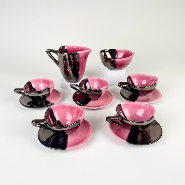 Ceramic coffee service made by Auguste Lucchesi (LUC) in Vallauris, comprising five triangular cups and round saucers, a...