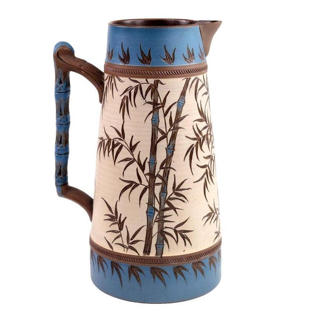 Slender, tapering lines define this stoneware water jug, showcasing the Japanese-inspired naturalism characteristic of the...