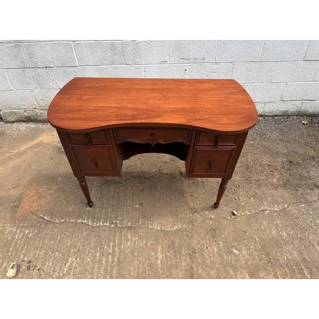 Early 20th Century French Louis XV Style Kidney Shaped Vanity Desk. It featuresa beautiful curved shape with a top that...