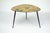 Elegant Italian mid-century modern low coffee table dating from the 1950s. The table features an organically shaped top...