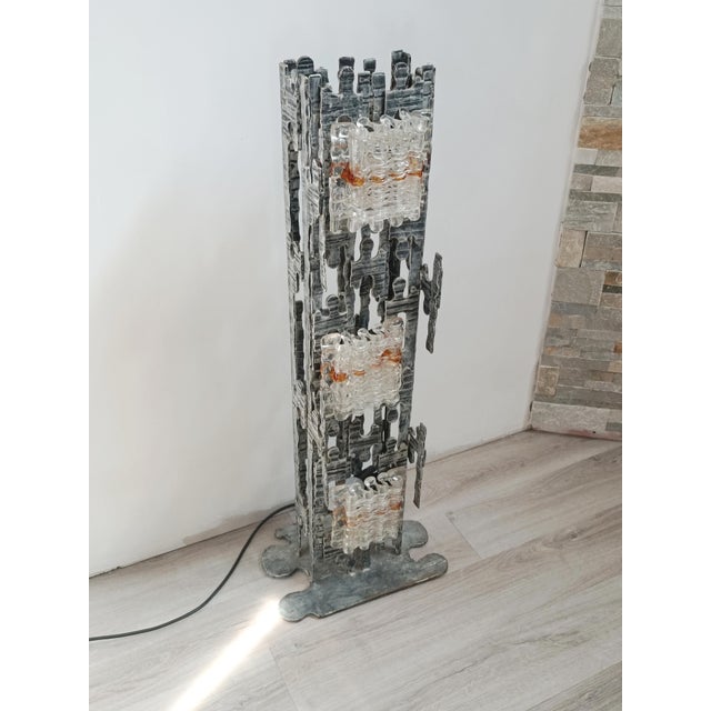 Spectacular and sculptural brutalist floor lamp by albano poli for poliarte. italy, 1970s. steel structure in the form of...