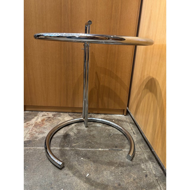 Iconic adjustable side table designed in 1927 by Irish designer Eileen Gray that she originally created for her E-1027...