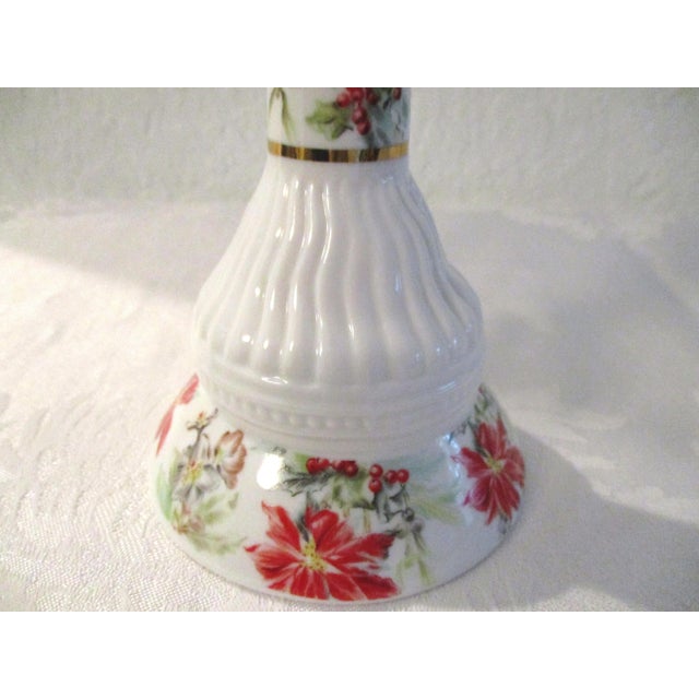 Lovely pair of mid-century white porcelain candle holders featuring a delicate Poinsettia and Holly Berry transferware...