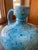 Glazed Ceramic Turquoise Blue Vase with floral accents and drops of 'confetti' in green and navy blue.