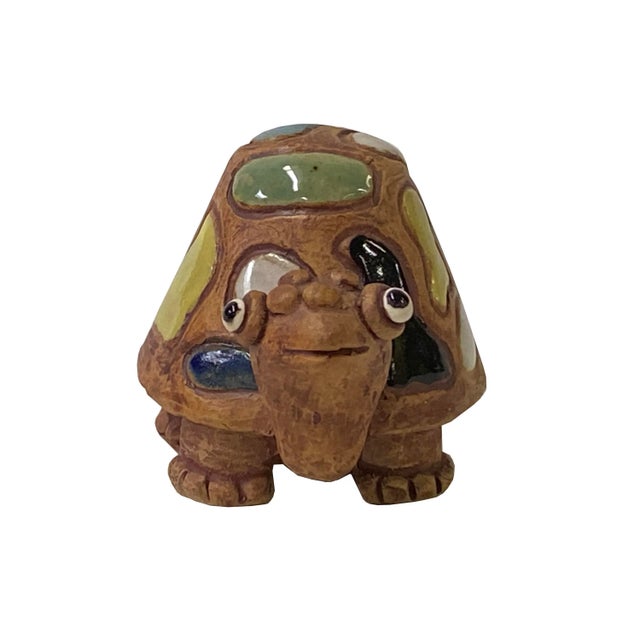 This is an artistic brown base multi-color turtle shape ceramic small animal display figure. Dimension: 5" x 3"x h3.5"...