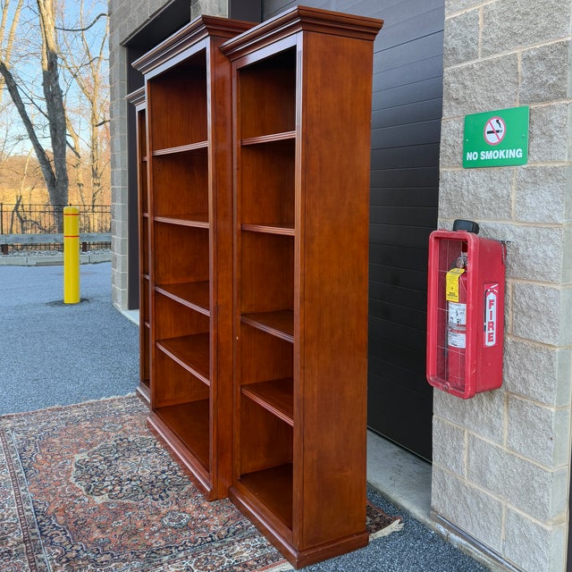 A set of three early 21st century Ballard Designs Tuscan collection Traditional pine left, right, and center bookcases,...