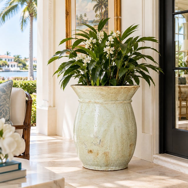 This generously proportioned terracotta planter features a beautifully aged ivory glaze with subtle celadon undertones,...