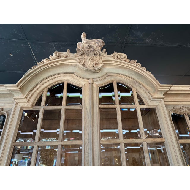 This is a 19th century French Louis XV style buffet à deux corps, finely crafted from bleached walnut and richly carved in...