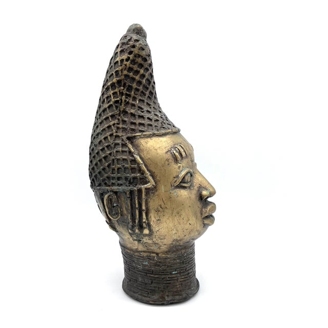 An impressive, handcrafted memorial sculpture of an Oba (king) from the Edo period. Standing at an imposing 38 cm tall and...