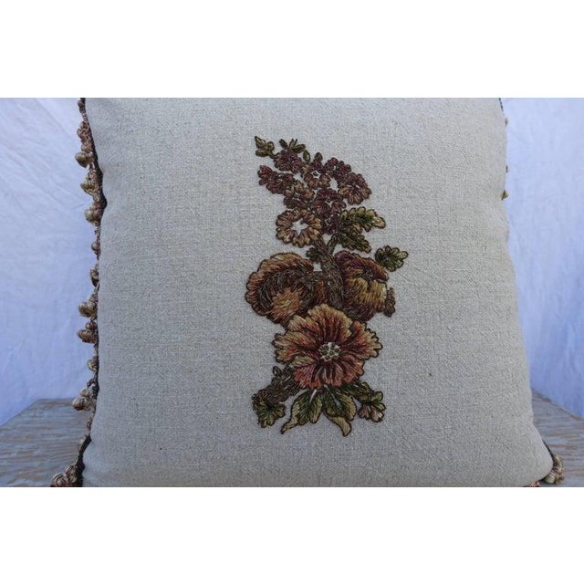 A pair of custom designed pillows by Melissa Levinson. 19th century metallic and chenille embroidered floral textile has...