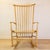 Vintage Scandinavian wooden rocking chair with spindle backrest in the style of Hans Wegner. Manufactured in the 1960s in...