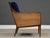 A mid century modern lounge chair newly reupholstered in blue velvet designed by Kipp Stewart for Directional. Solid...