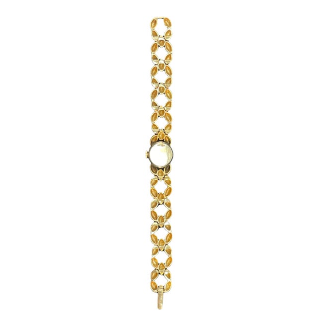 Elegant vintage 1950s Rolex ladies wristwatch crafted in solid 14K yellow gold, featuring a refined dress watch design...