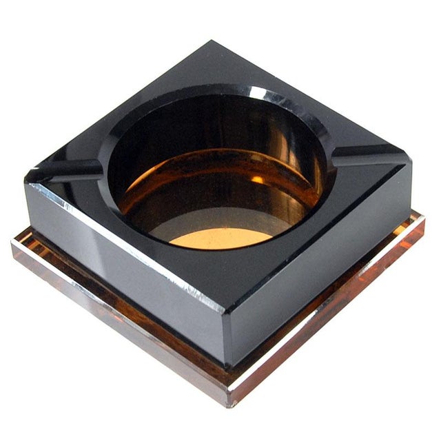 A large, massive Art Deco crystal ashtray in the style of French designer Jean Luce. Originally from the 1930s in France,...