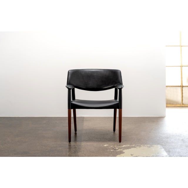 Very rare and iconic armchair from the 1950s, crafted from premium teak wood and upholstered in high-quality leather....
