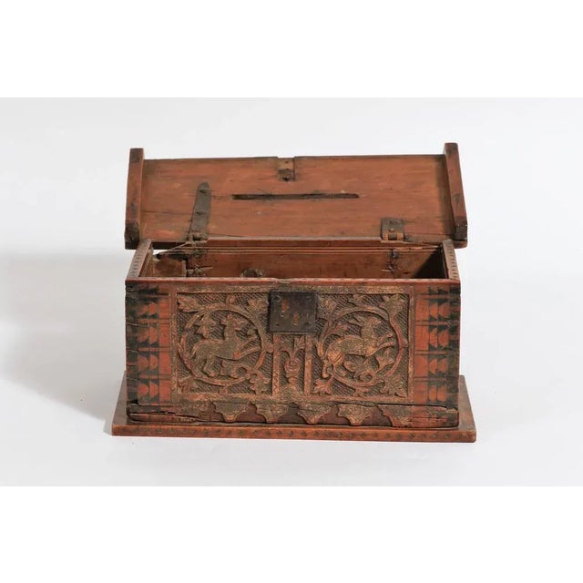 Wooden box, called Minnekästchen, engraved with a dog, a hare and foliage with Polychromy remains. In the Middle Ages, the...