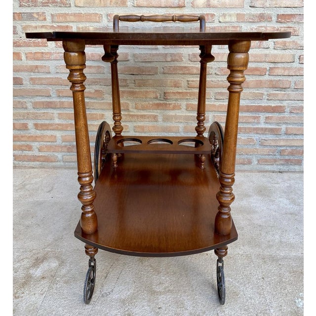 This French style serving cart is a stunning piece of furniture that will add a touch of elegance to any room. The cart is...