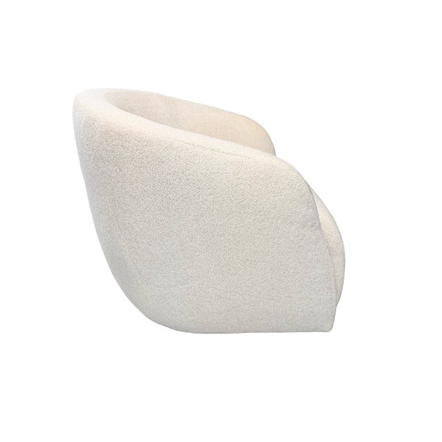 Beautiful Verellen accent chair featuring a rounded barrel silhouette, gently curved arms, and ivory textured upholstery....