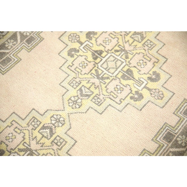 Introducing a one-of-a-kind vintage Turkish hand-knotted wool rug, carefully crafted by skilled artisans using traditional...