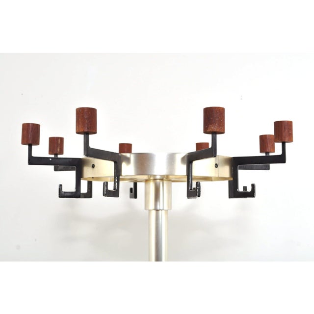 Beautiful vintage coat rack from the 1960s. This standing coat rack has 8 swivel hooks and an umbrella stand. 1960s....